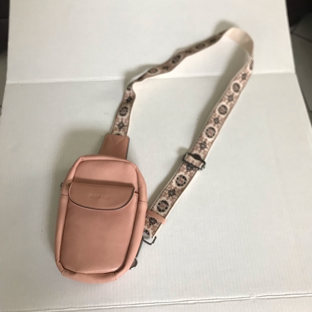 Tan Sling package with floral strap